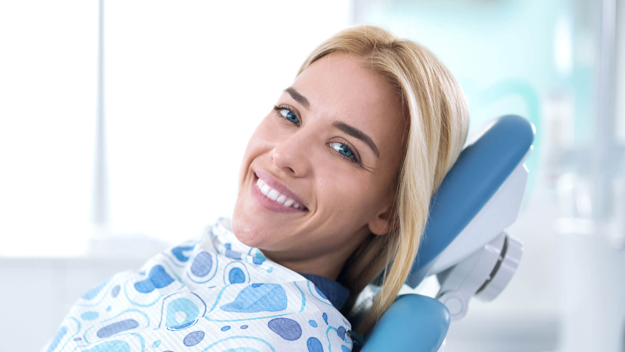 Smiling Woman in Dentist Chair